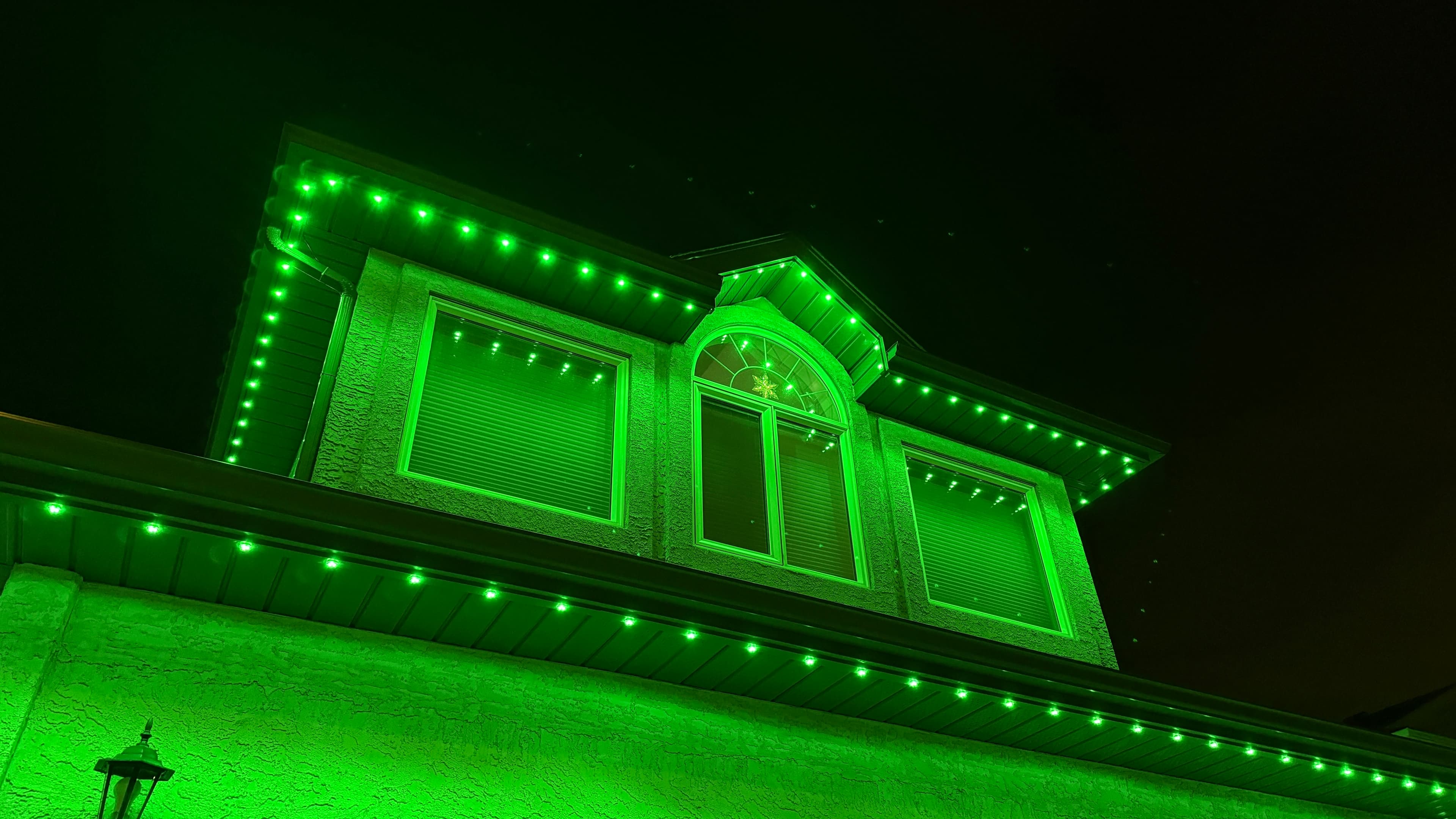 Day to night home lighting transformation with subtle daytime profile.