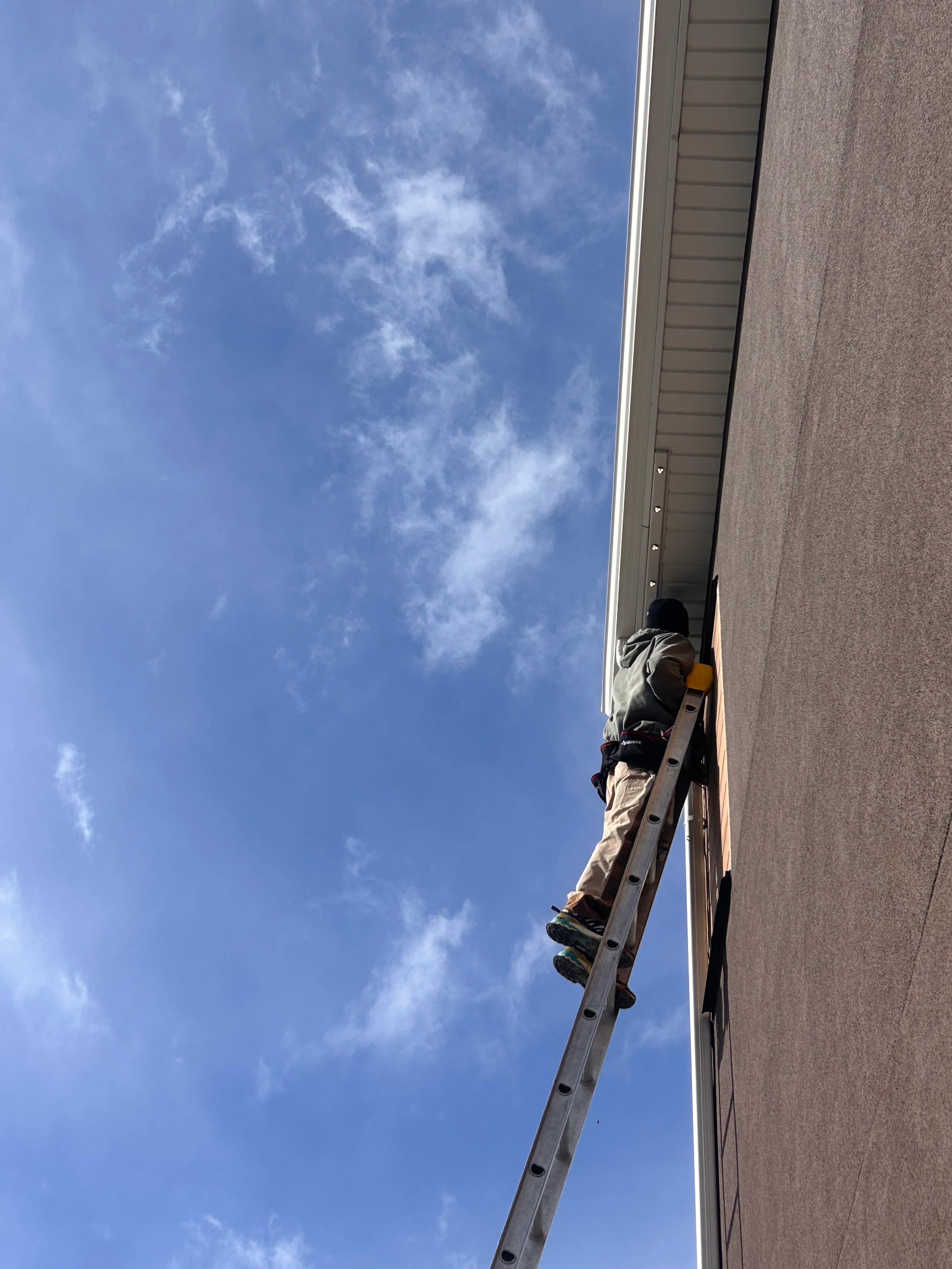 Luminair installer working on a residential roofline