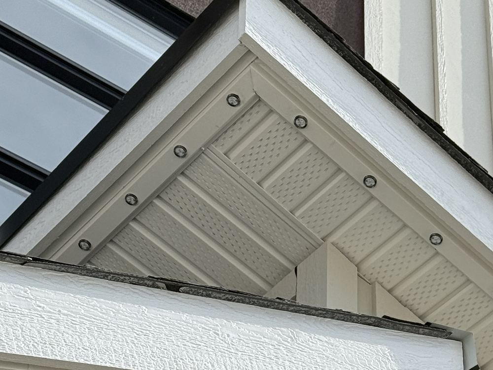 Close-up of Luminair colour-matched track in daylight, the sealed fixtures sitting flush in the soffit and fascia